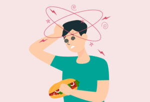 Man experiencing digestive discomfort after consuming gluten-containing foods like sandwiches.