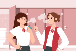 Two youths vaping in a restroom, highlighting the growing prevalence of vaping among young people in Asia.