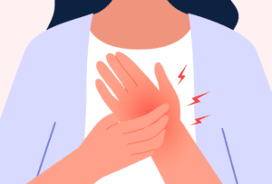 Woman experiencing hand numbness, possibly caused by carpal tunnel syndrome.
