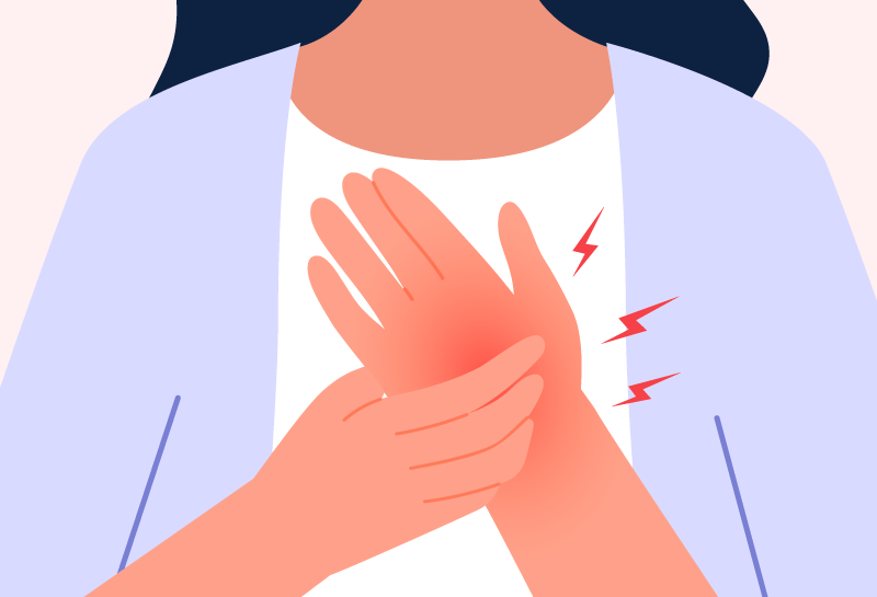 Woman experiencing hand numbness, possibly caused by carpal tunnel syndrome.