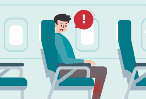 Man taking measures to manage deep vein thrombosis (DVT) during a long flight.