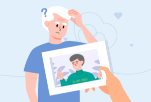 Caregiver reminiscing while viewing a photo of a loved one affected by dementia.