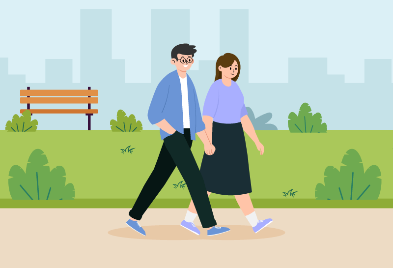Couple in their 40s taking a brisk walk as a form of exercise.