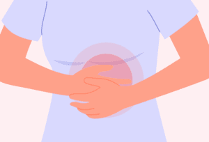 Woman dealing with ongoing stomach discomfort that may be caused by dyspepsia