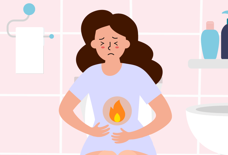 Woman showing symptoms of a urinary tract infection, such as burning while urinating.